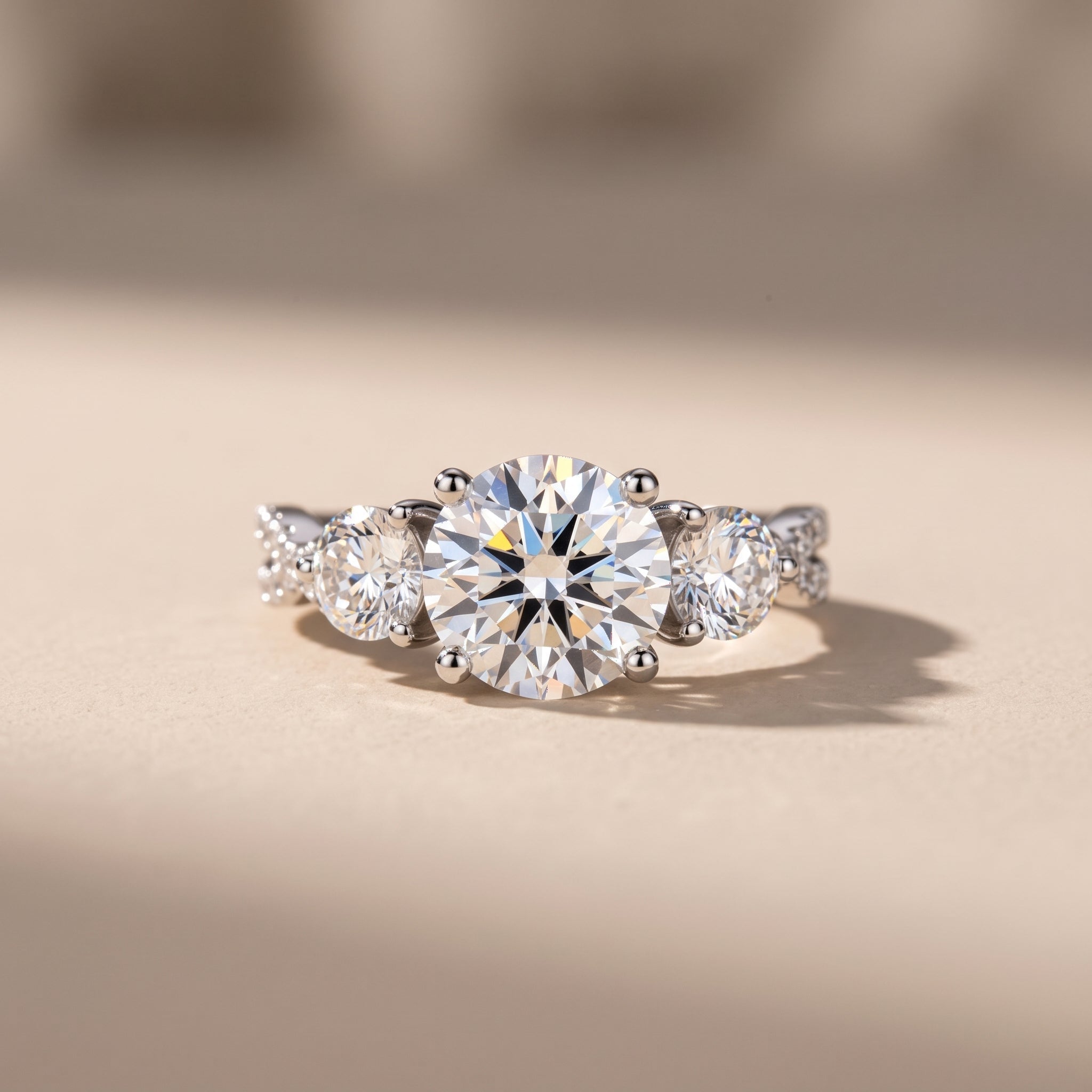 White Metal Round Moissanite Three-Stone Engagement Ring