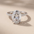 White Gold Oval Cut Moissanite Engagement Ring with Pavé Band