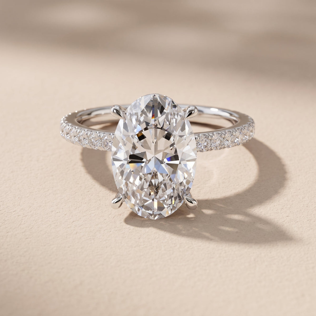 White Gold Oval Cut Moissanite Engagement Ring with Pavé Band