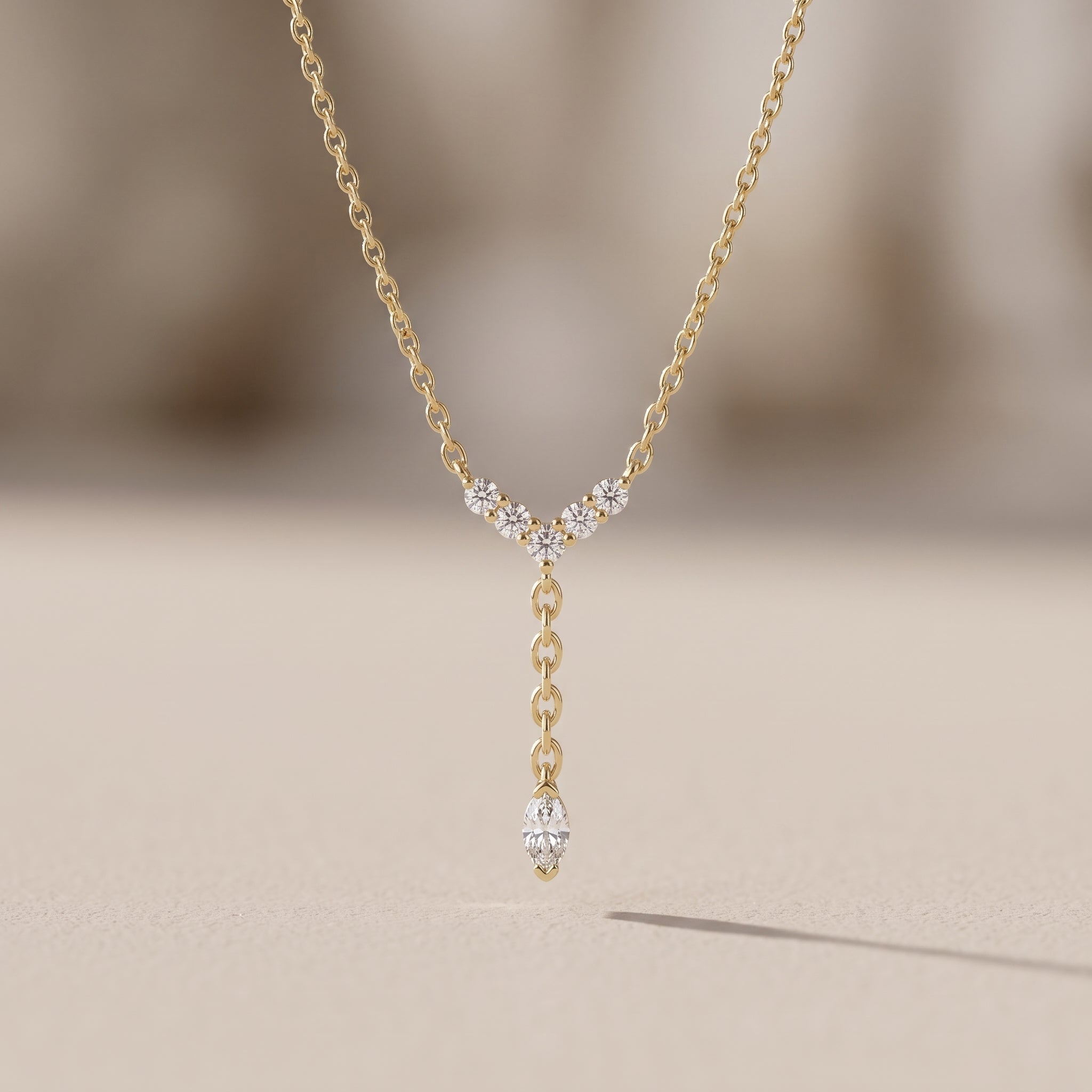 Yellow Gold Marquise Moissanite Lariat Necklace with Round Accents