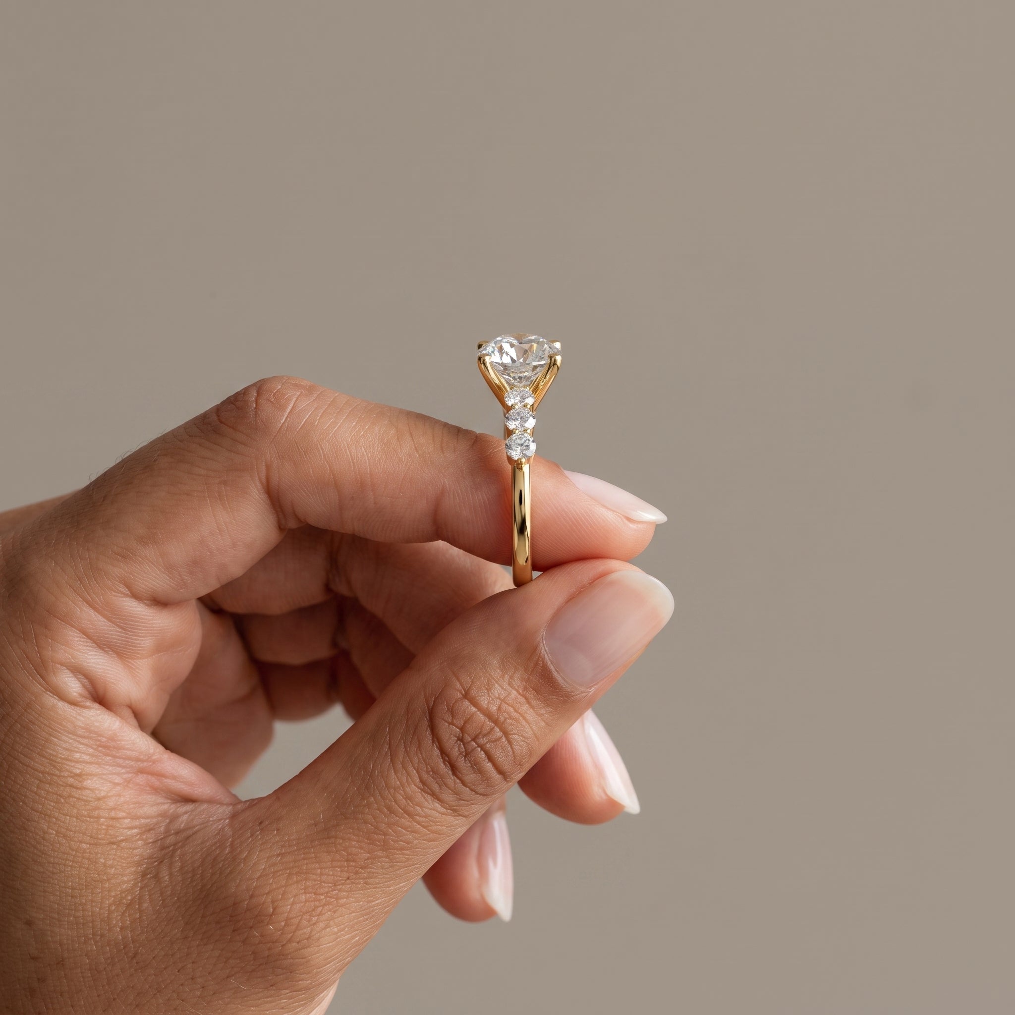 Yellow Gold Round Moissanite Engagement Ring with Side Stones