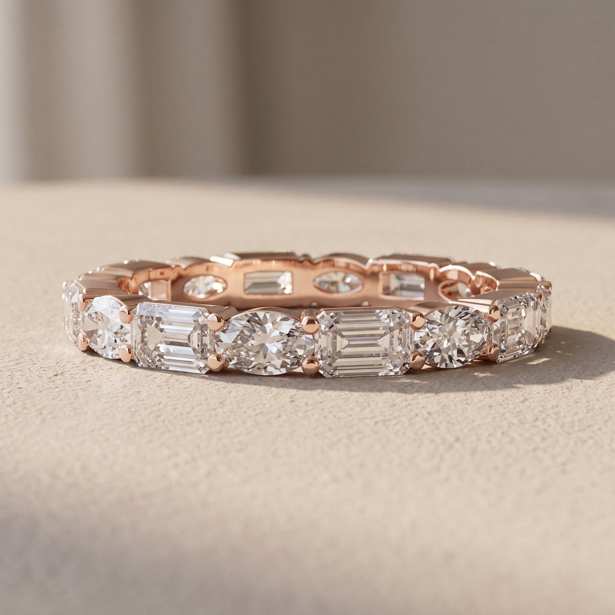 Rose Gold Alternating Oval & Emerald Cut Moissanite Eternity Band