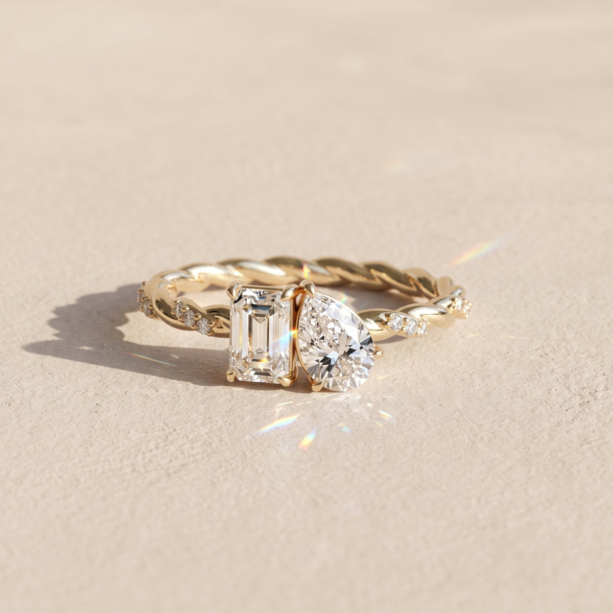 Yellow Gold Emerald & Pear Cut Moissanite Twist Ring