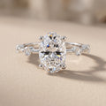 White Metal Oval Cut Moissanite Engagement Ring with Accent Stones