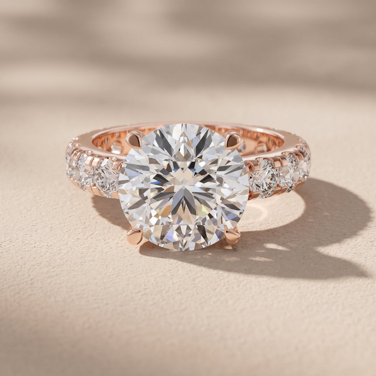 Rose Gold Round Cut Moissanite Engagement Ring with Side Stones