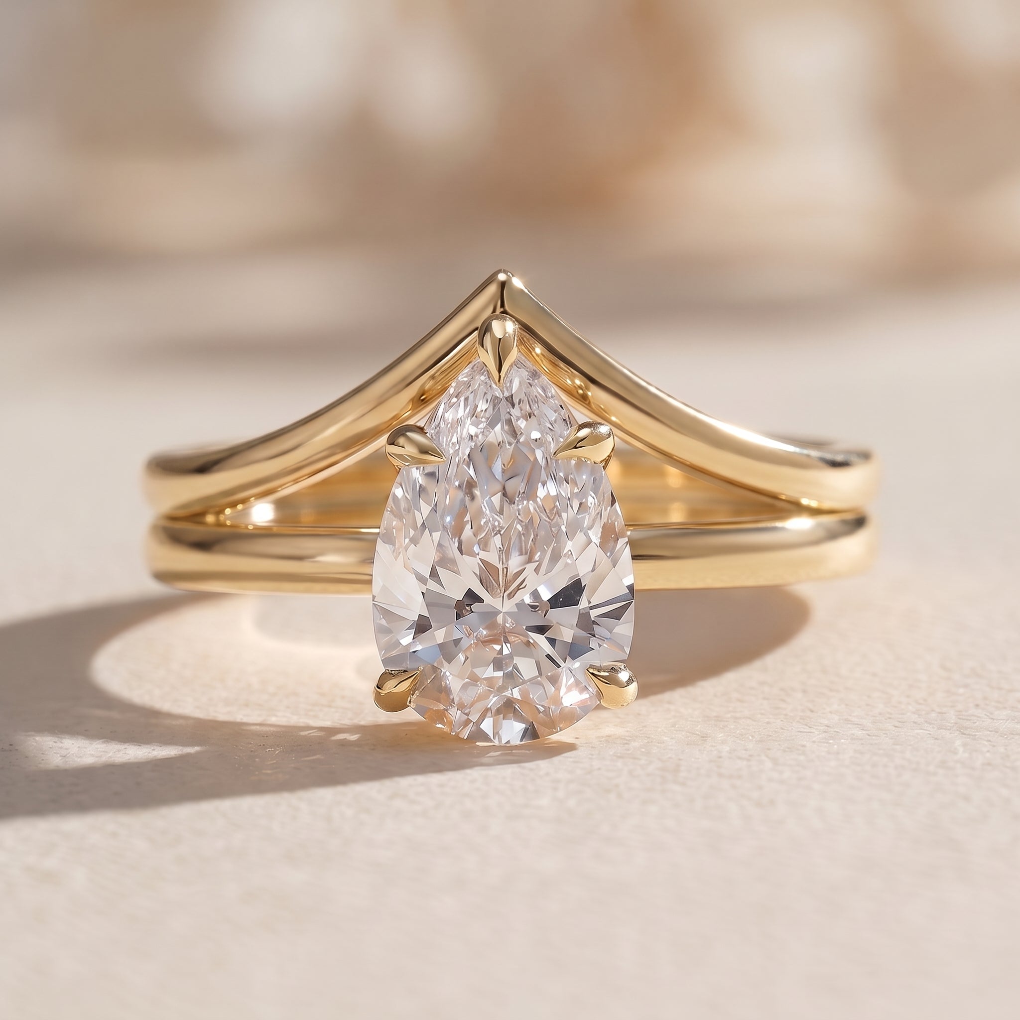 Yellow Gold Pear Cut Moissanite Engagement Ring with Chevron Band