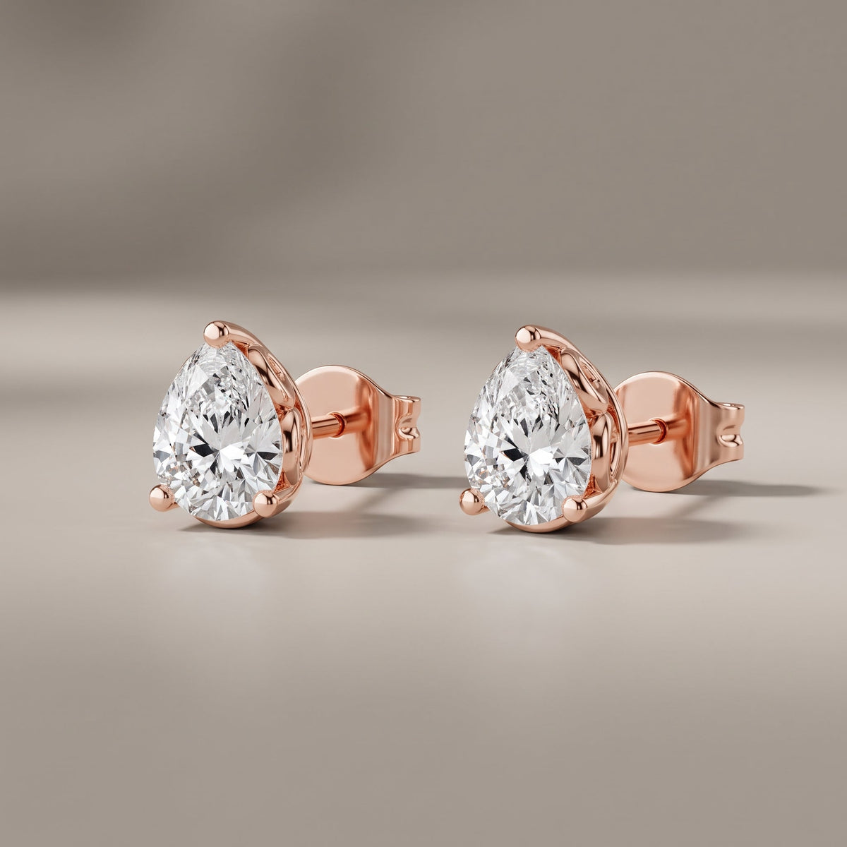 Rose Gold Pear Cut Moissanite Stud Earrings