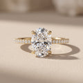 Yellow Gold Oval Moissanite Engagement Ring with Pavé Band