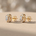 Yellow Gold Round Moissanite Stud Earrings with Swirl Halo Design