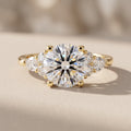 Yellow Gold Round Moissanite Engagement Ring with Side Stones