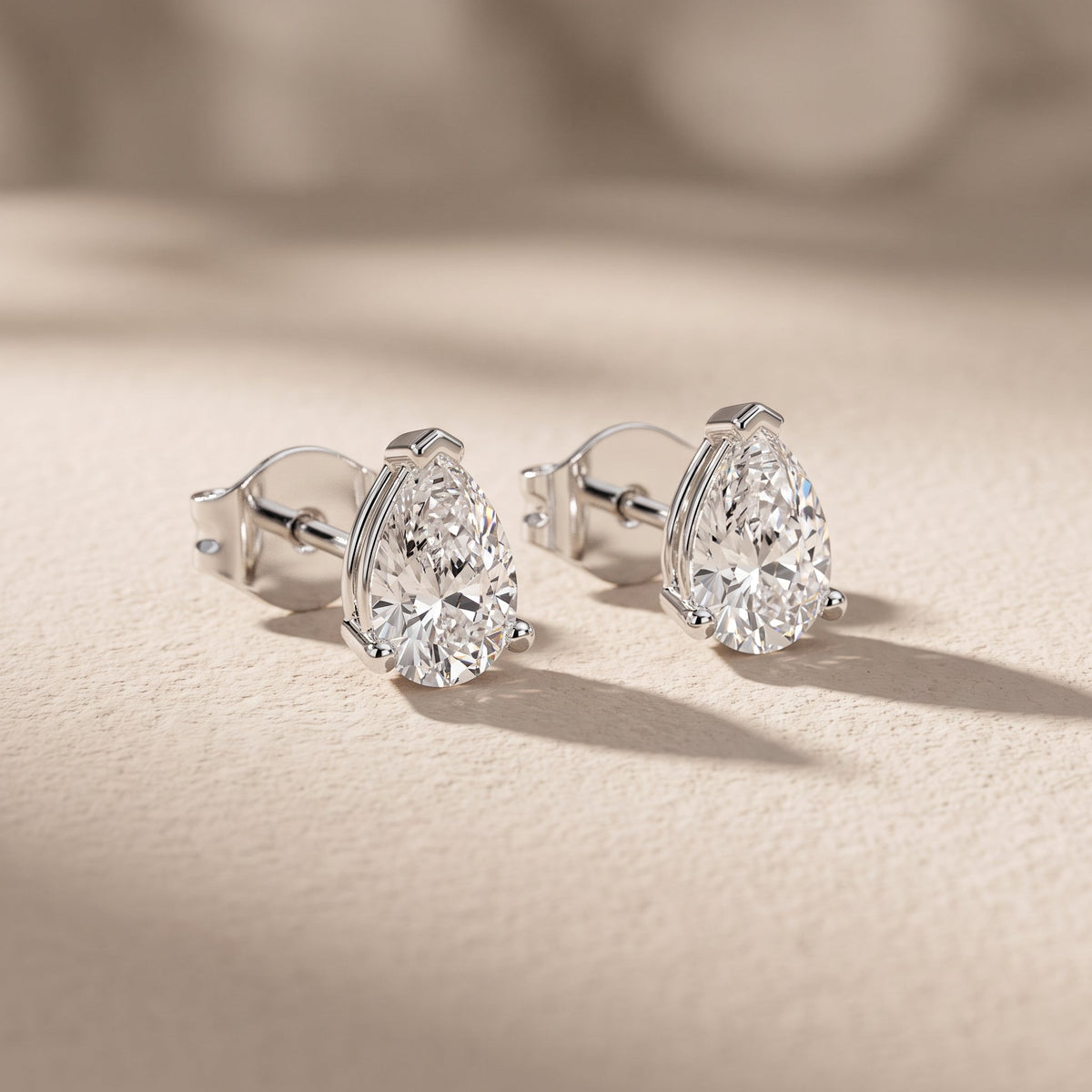 White Pear Cut Moissanite Stud Earrings