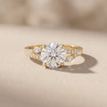 Yellow Gold Round Moissanite Engagement Ring with Leaf Accents