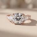Rose Gold Cushion Moissanite Engagement Ring with Tapered Side Stones