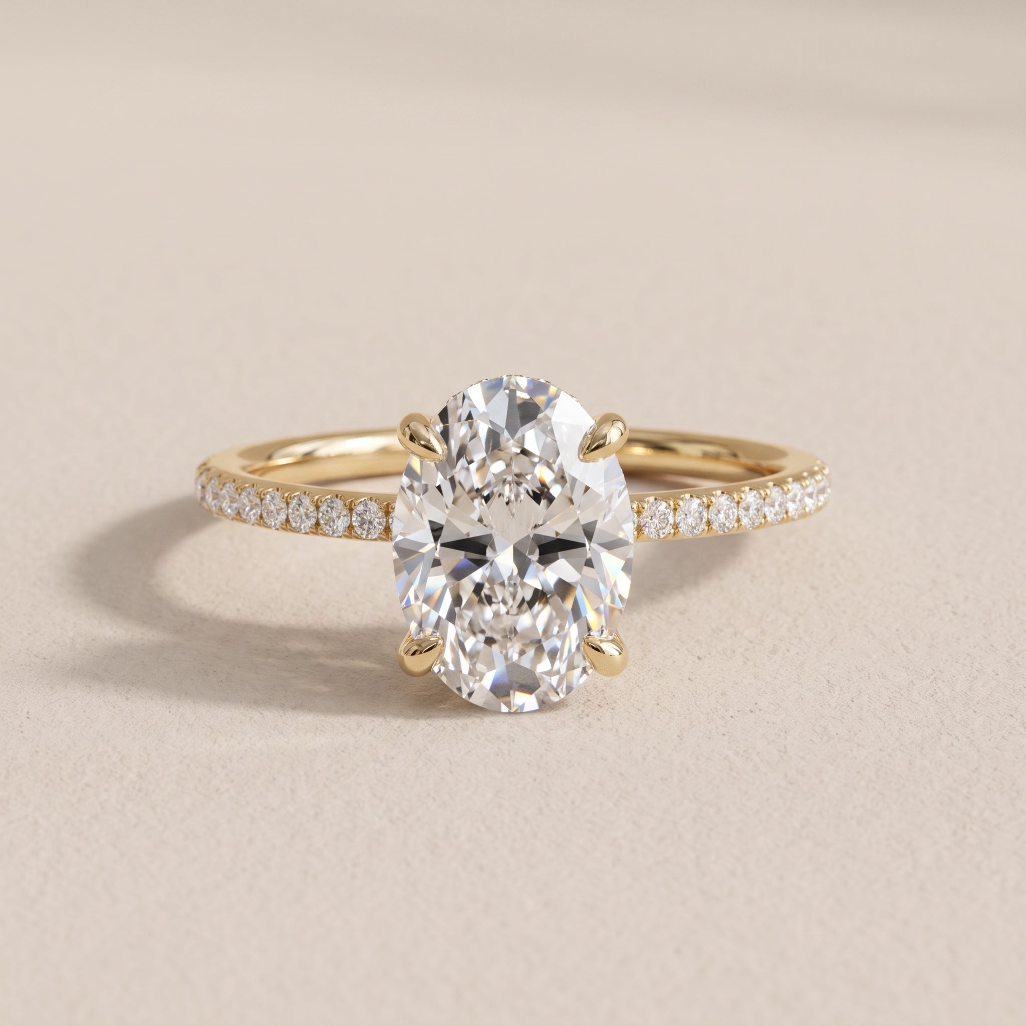Yellow Gold Oval Moissanite Engagement Ring with Pavé Band