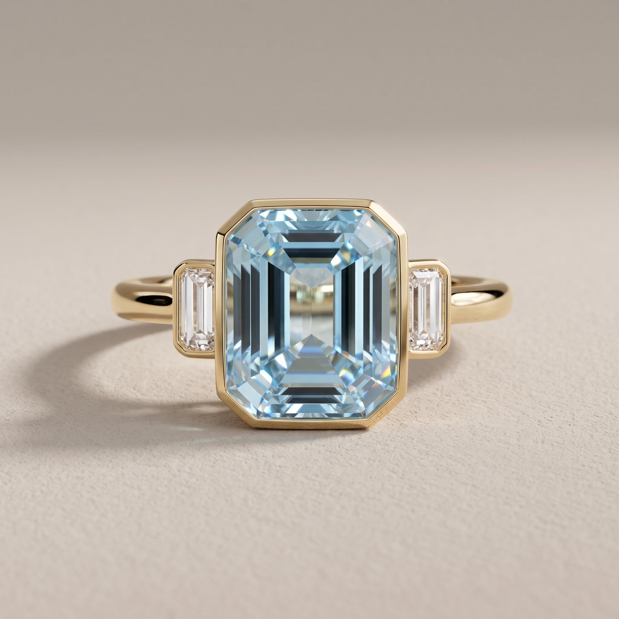 Yellow Gold Emerald Cut Blue Moissanite Three-Stone Ring
