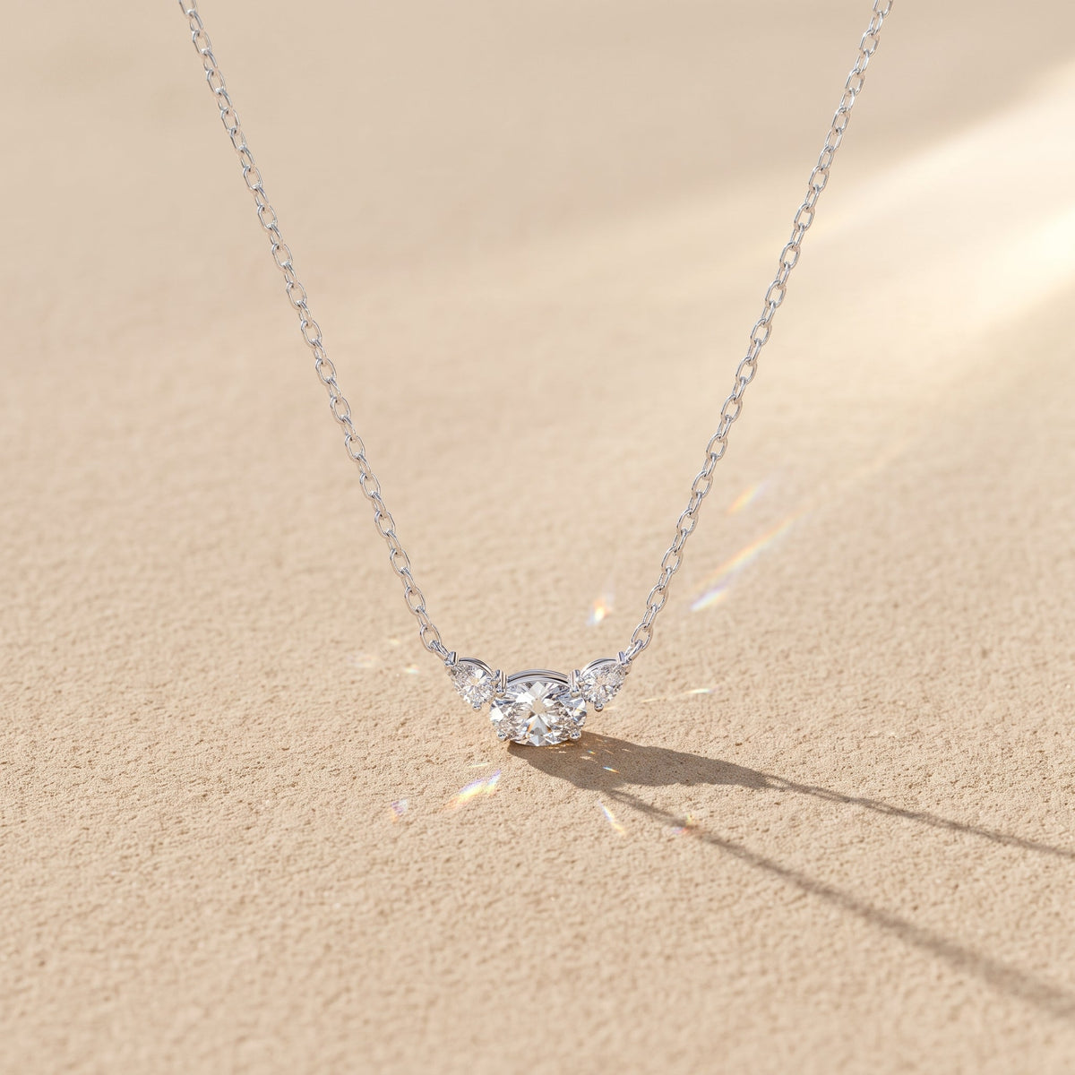 White Metal Oval Moissanite Three Stone Pendant Necklace