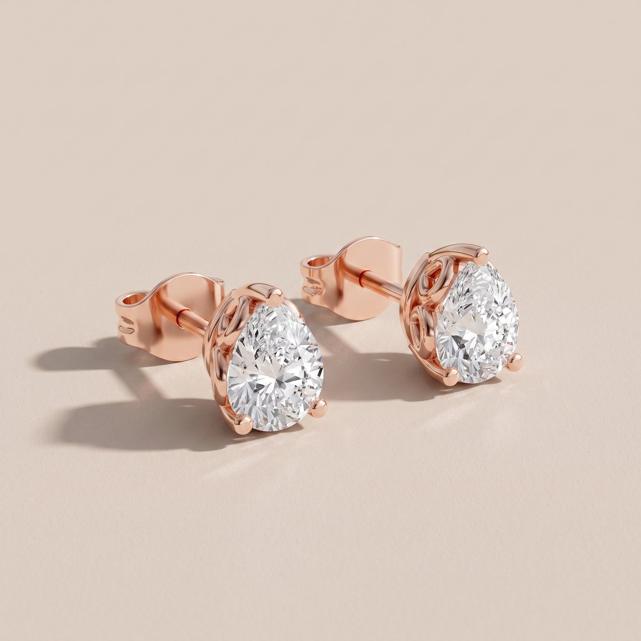 Rose Gold Pear Cut Moissanite Stud Earrings