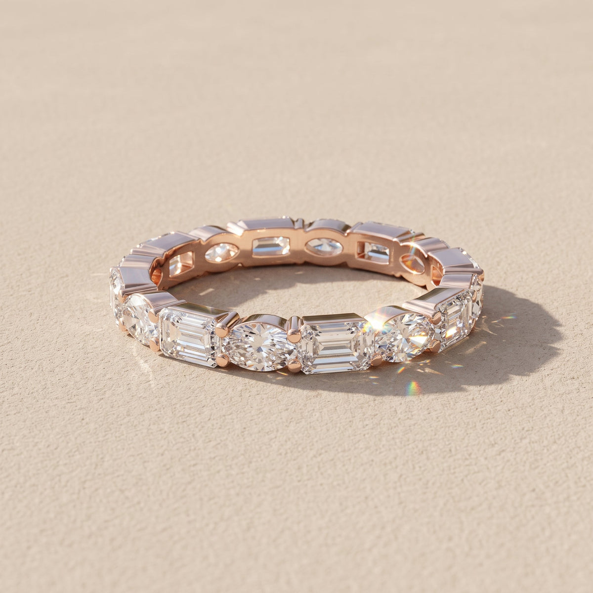 Rose Gold Alternating Oval & Emerald Cut Moissanite Eternity Band