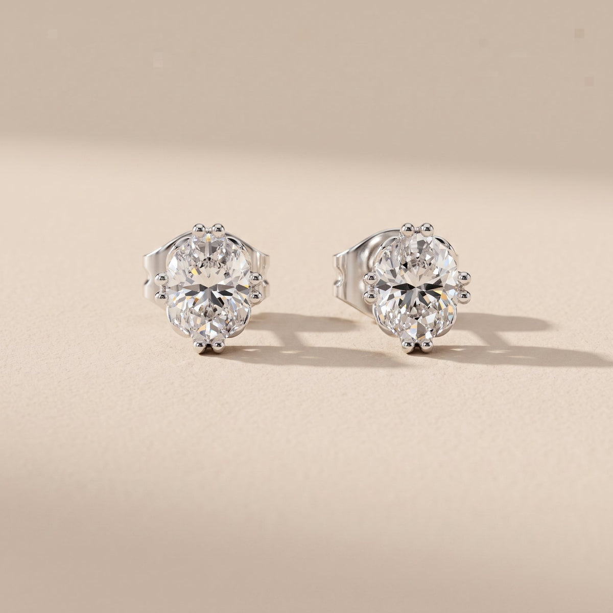 White Metal Oval Cut Moissanite Stud Earrings