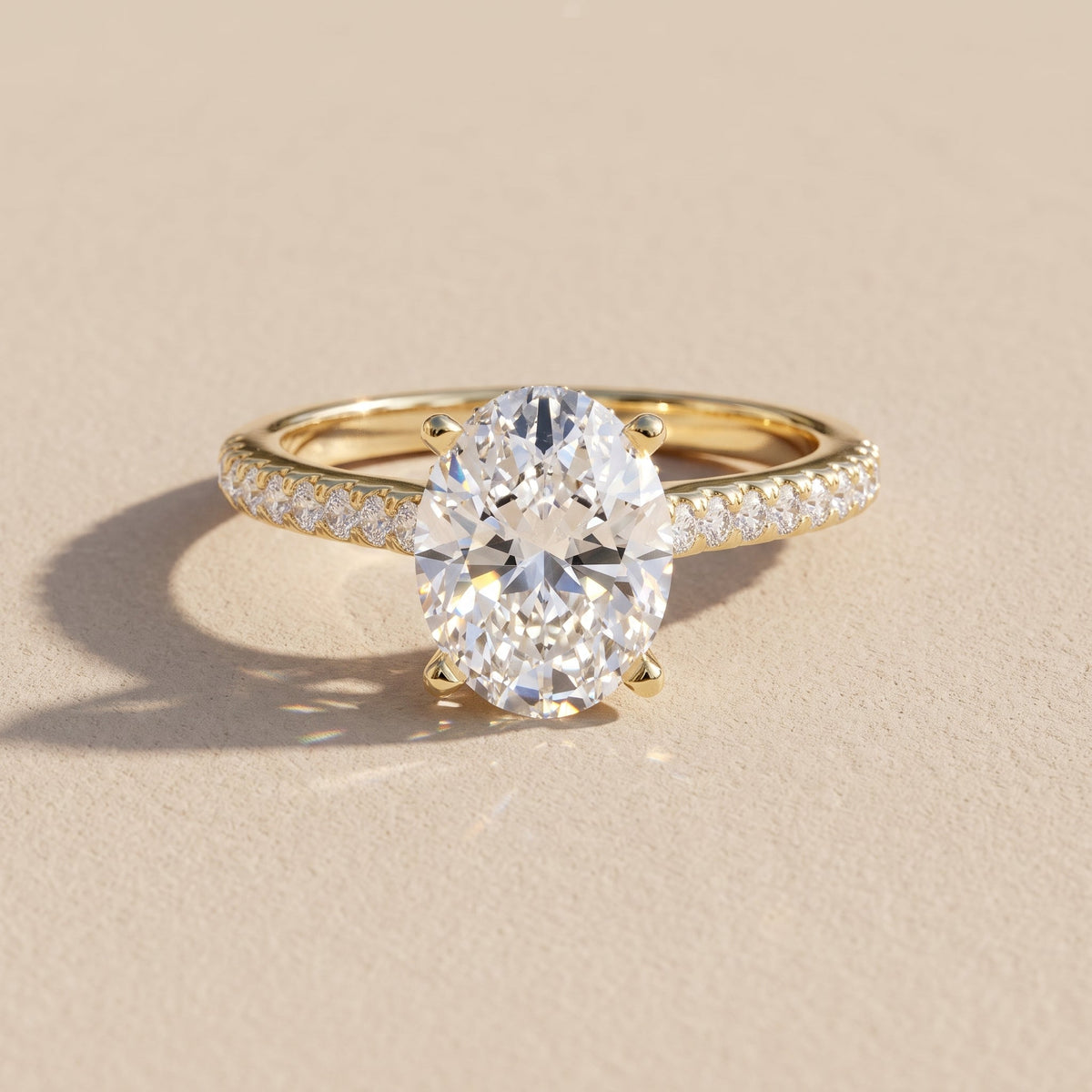 Yellow Gold Oval Cut Moissanite Engagement Ring with Pavé Band
