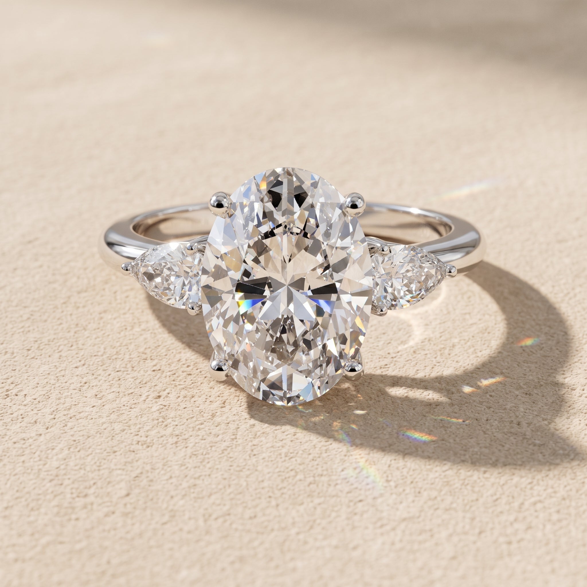 White Gold Oval Moissanite Three-Stone Engagement Ring