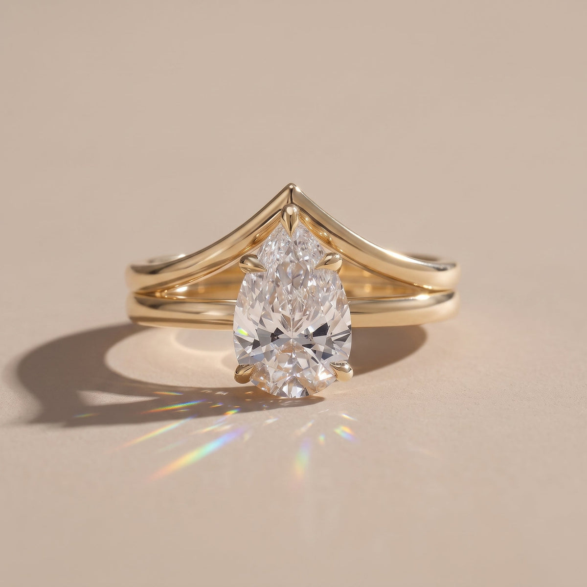Yellow Gold Pear Cut Moissanite Engagement Ring with Chevron Band