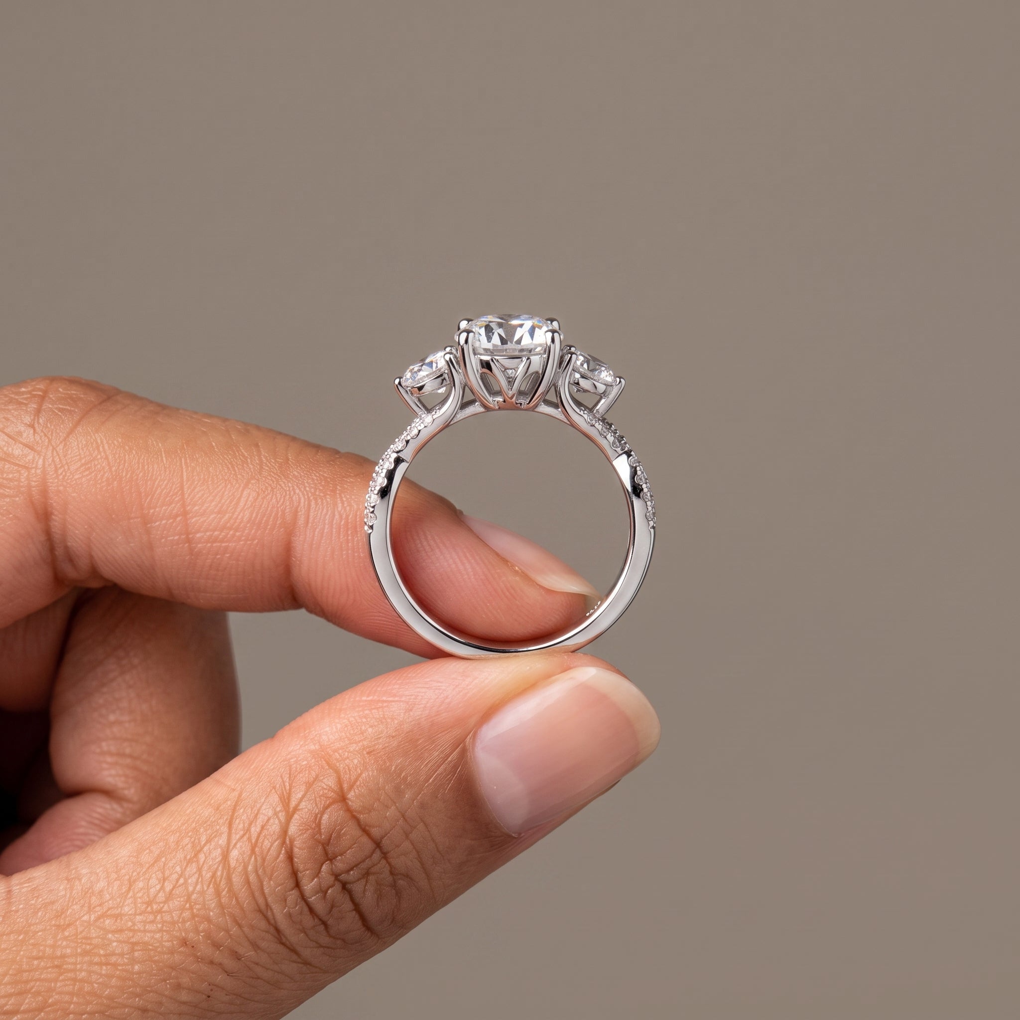 White Metal Round Moissanite Three-Stone Engagement Ring