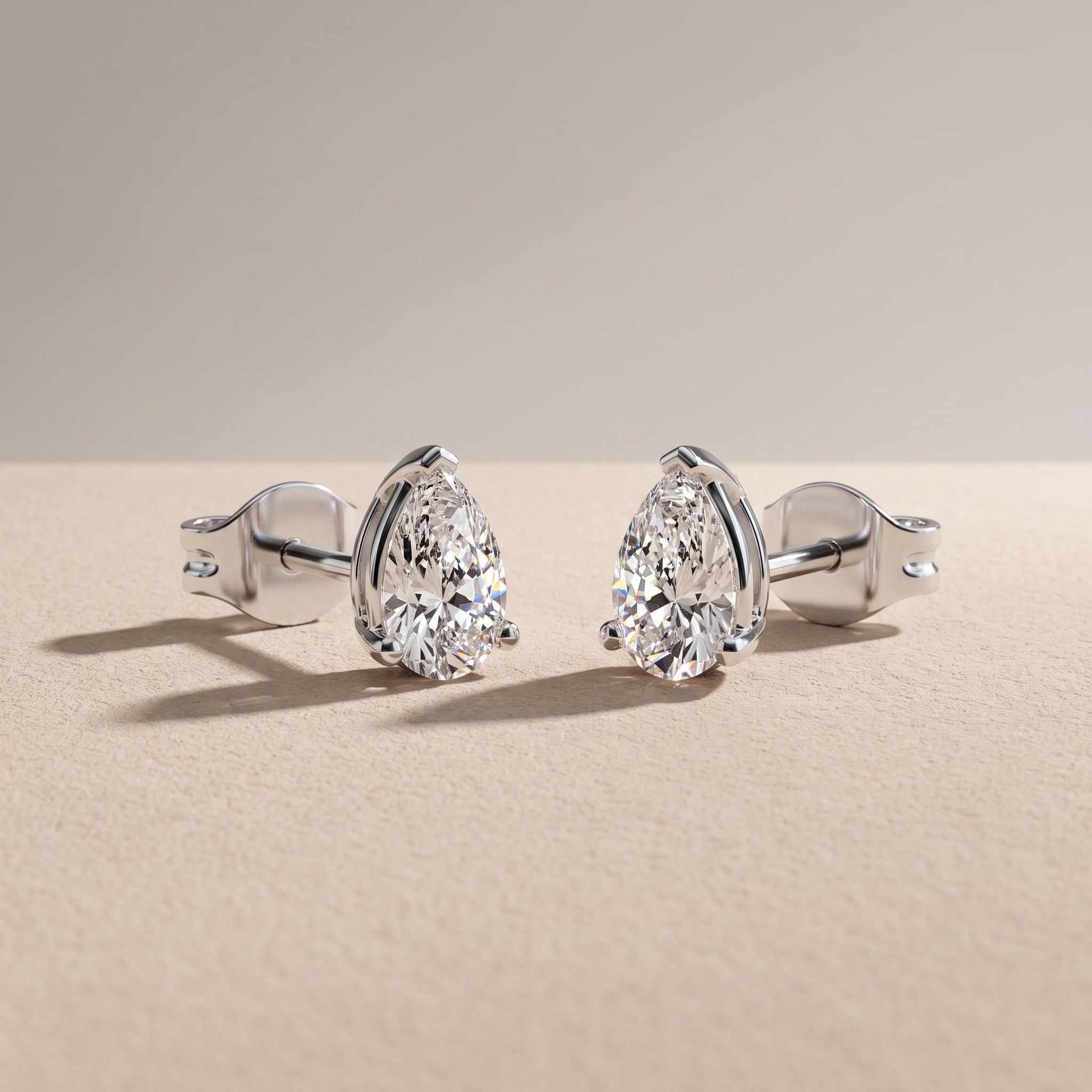 White Pear Cut Moissanite Stud Earrings