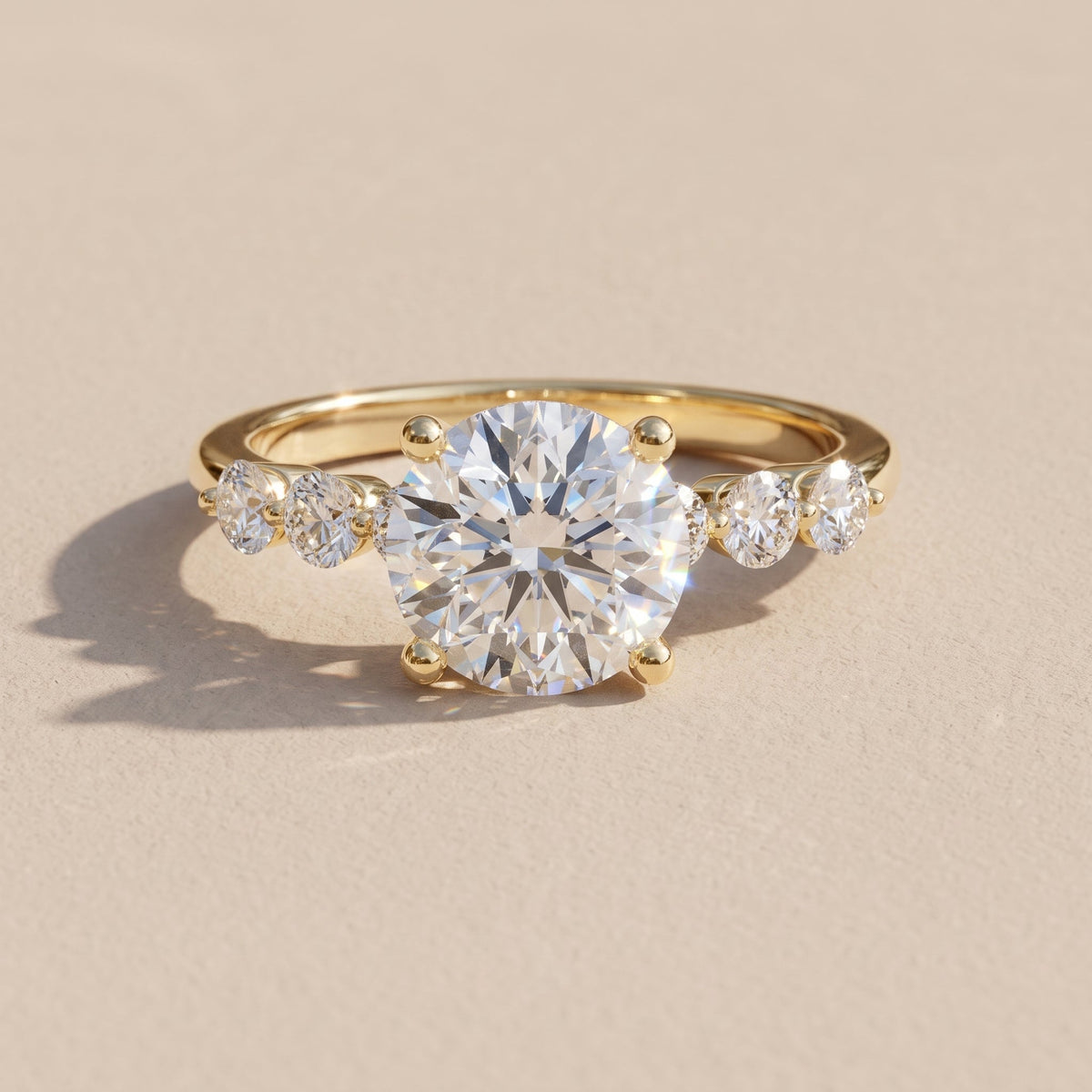Yellow Gold Round Moissanite Engagement Ring with Side Stones