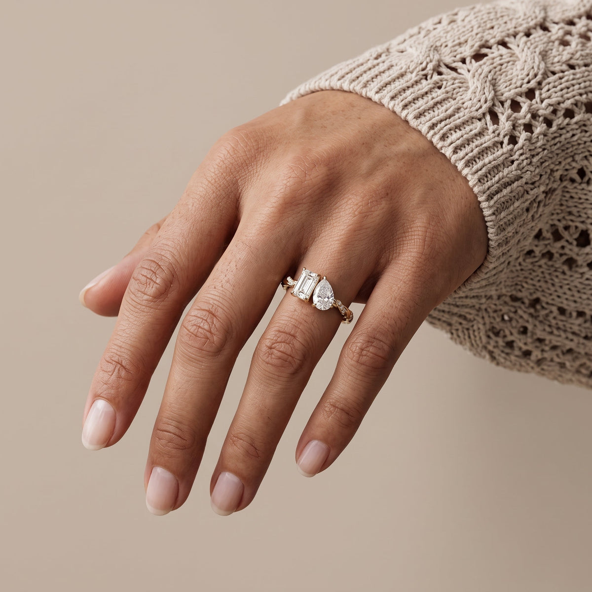 Yellow Gold Emerald & Pear Cut Moissanite Twist Ring