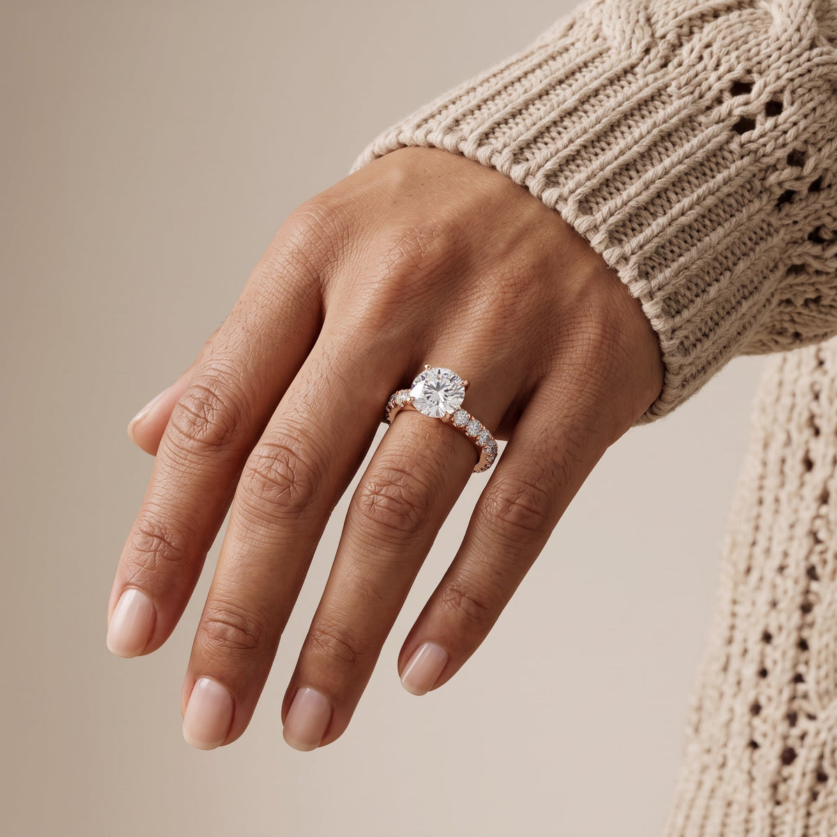 Rose Gold Round Cut Moissanite Engagement Ring with Side Stones