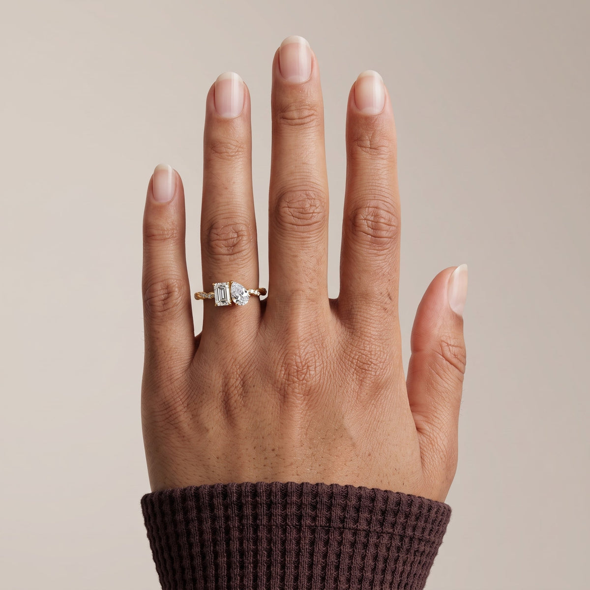 Yellow Gold Emerald & Pear Cut Moissanite Twist Ring