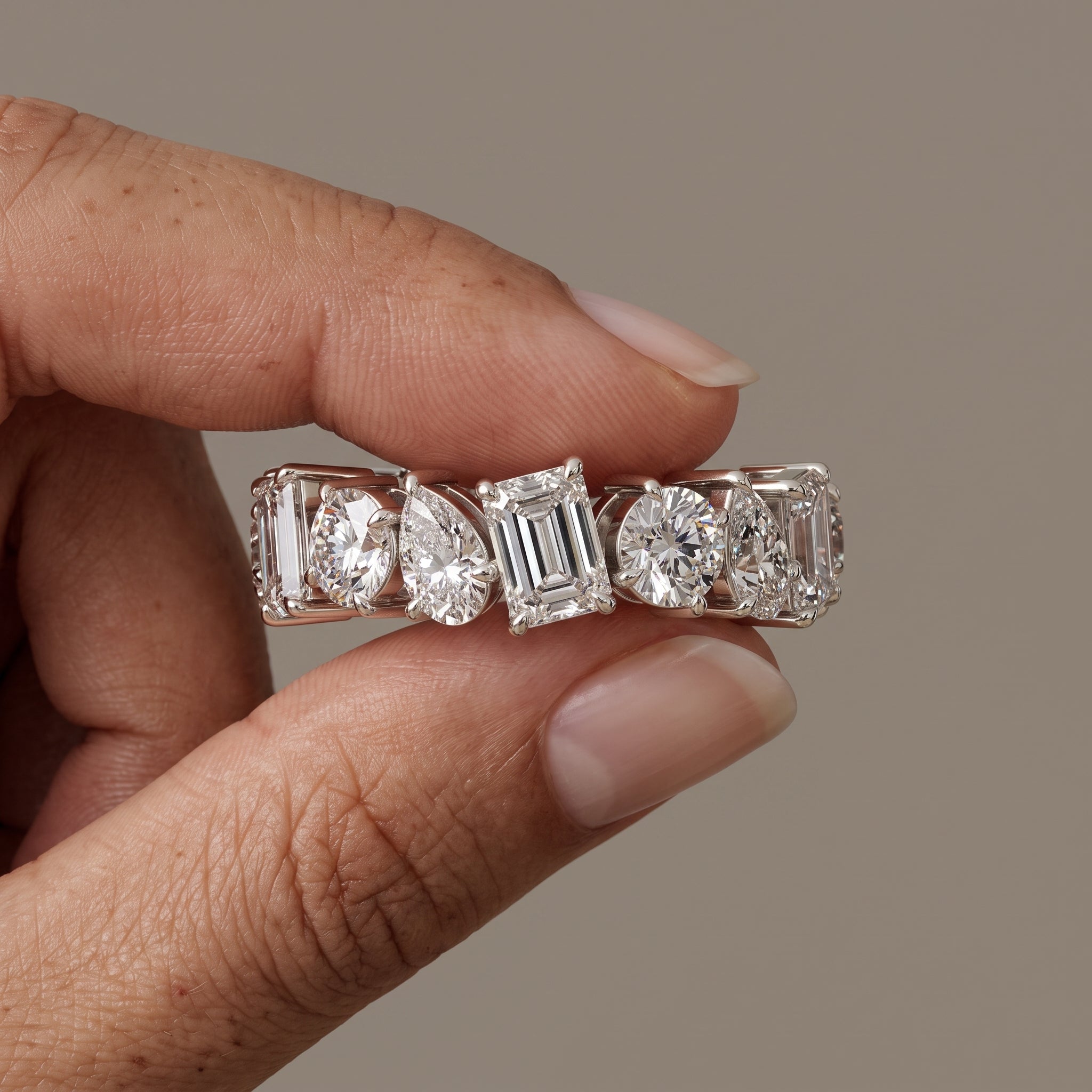 White Metal Alternating Emerald, Pear & Round Moissanite Eternity Band Ring