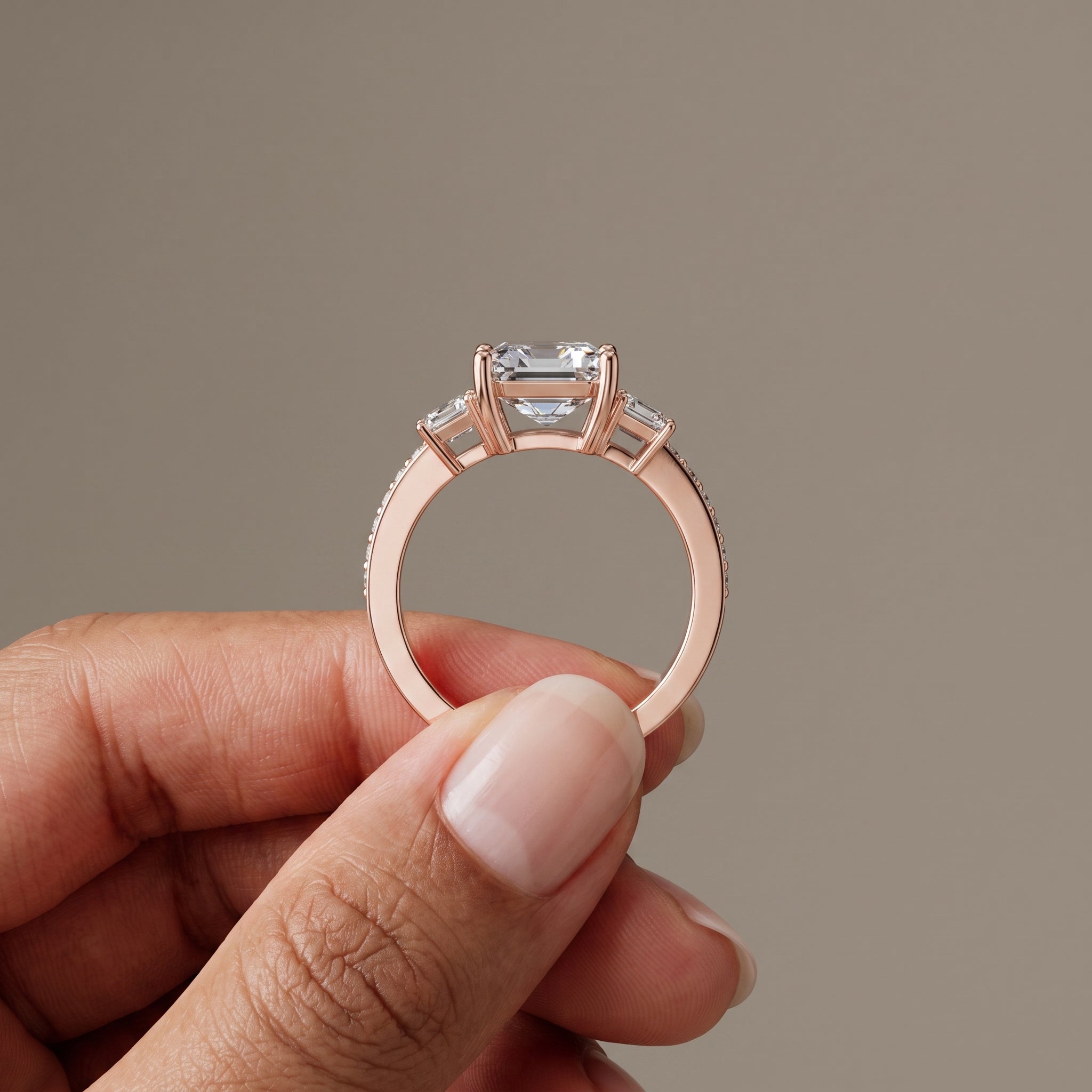Rose Gold Emerald Cut Moissanite Three Stone Engagement Ring