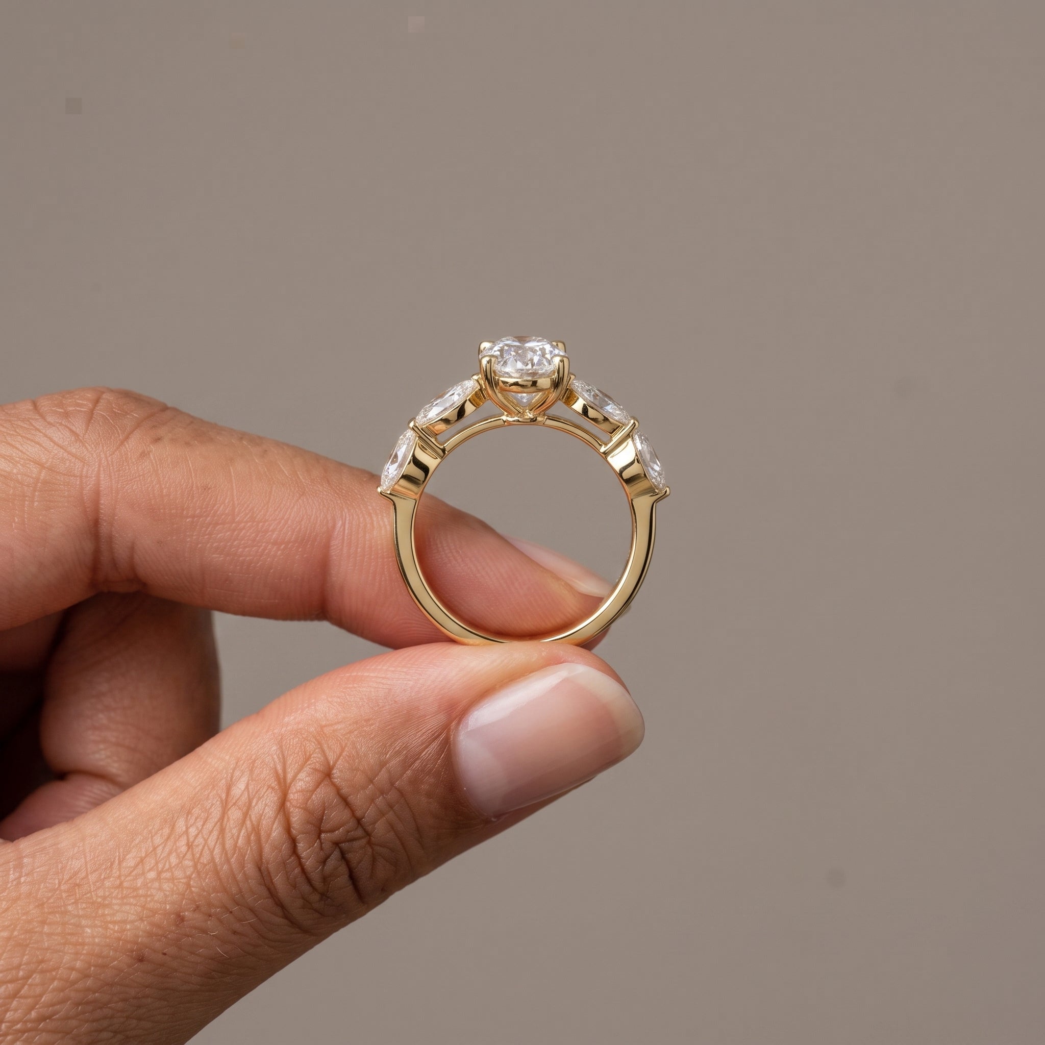 Yellow Gold Oval Moissanite Engagement Ring with Marquise Accents