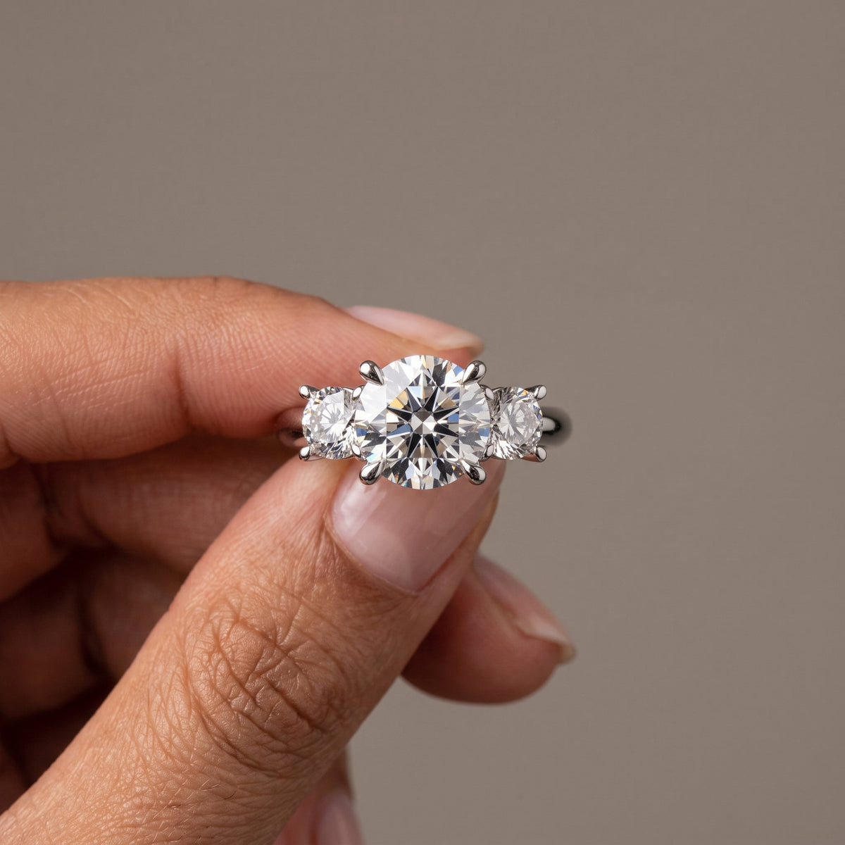 White Metal Round Moissanite Three Stone Engagement Ring