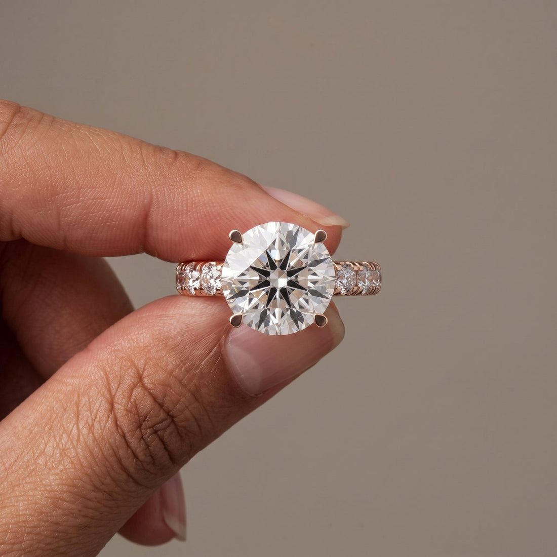 Rose Gold Round Cut Engagement Ring with Side Stones