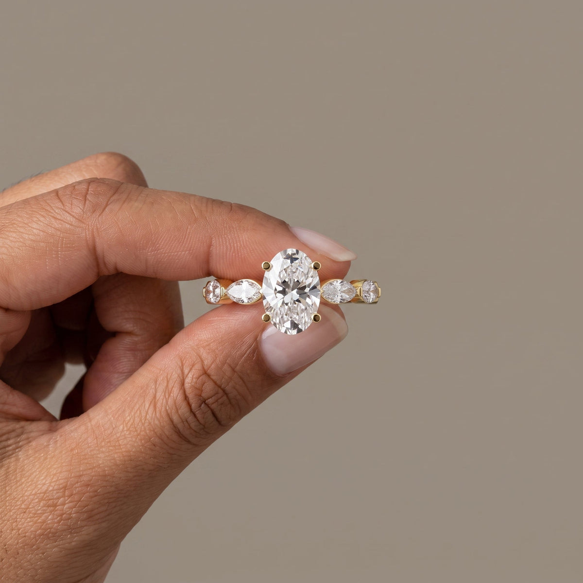 Yellow Gold Oval Moissanite Engagement Ring with Marquise Accents