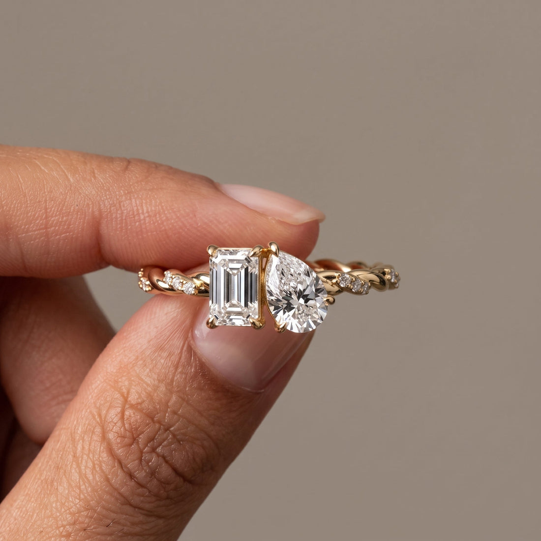 Yellow Gold Emerald & Pear Cut Twist Ring