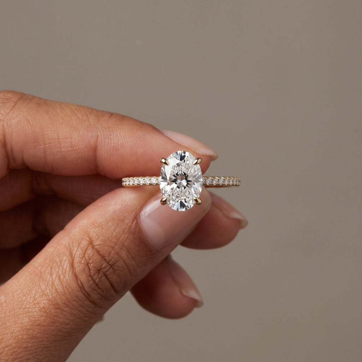 Yellow Gold Oval Moissanite Engagement Ring with Pavé Band