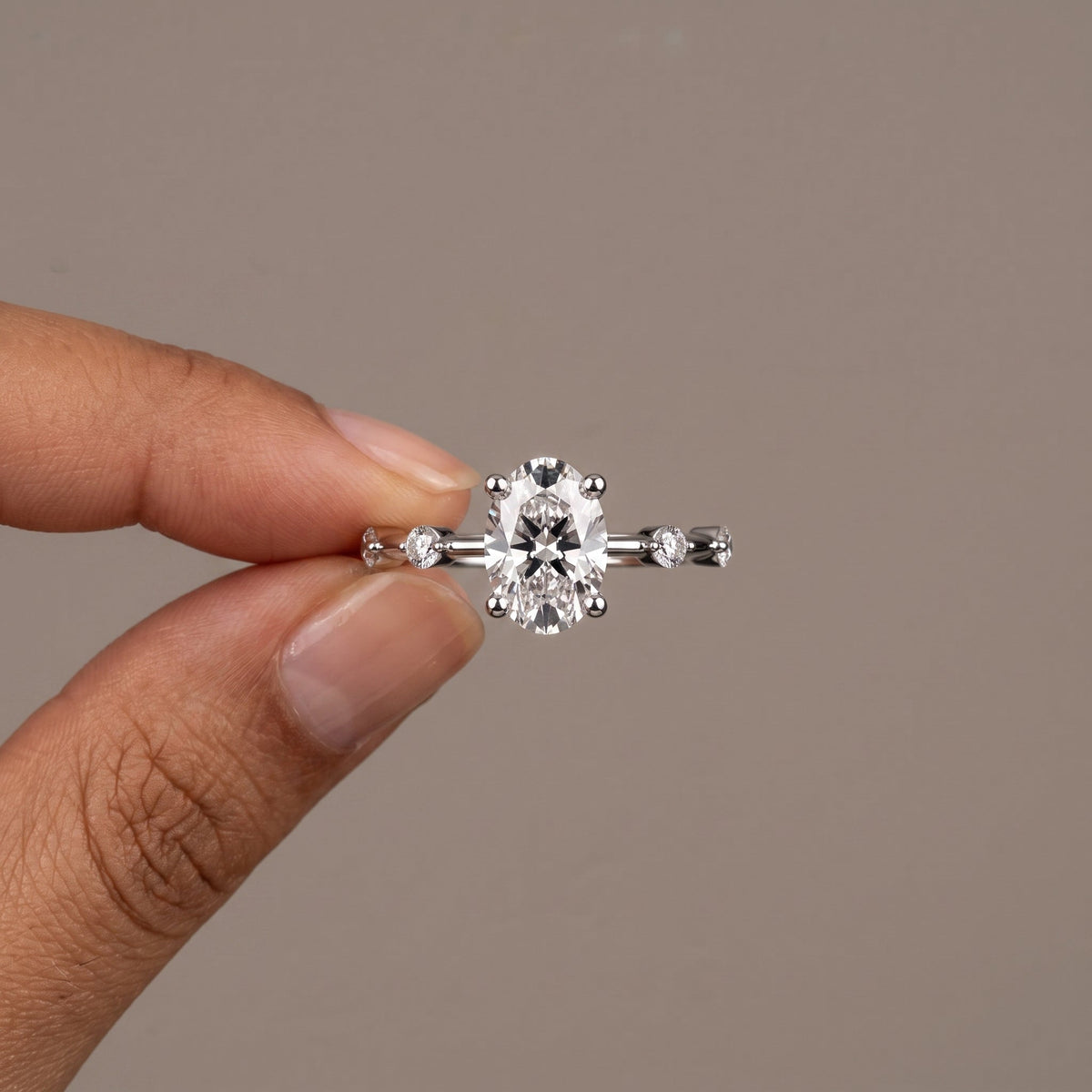 White Metal Oval Cut Moissanite Engagement Ring with Accent Stones