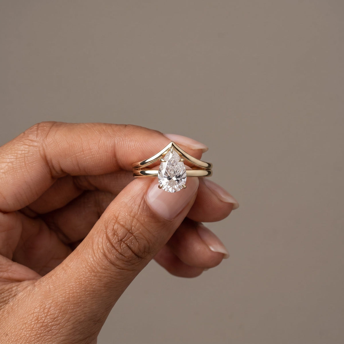 Yellow Gold Pear Cut Moissanite Engagement Ring with Chevron Band