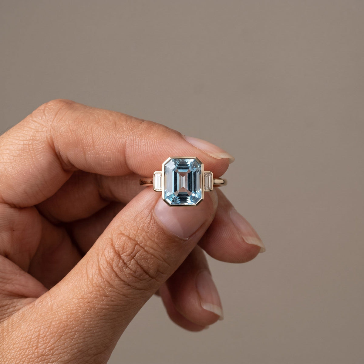 Yellow Gold Emerald Cut Blue Moissanite Three-Stone Ring