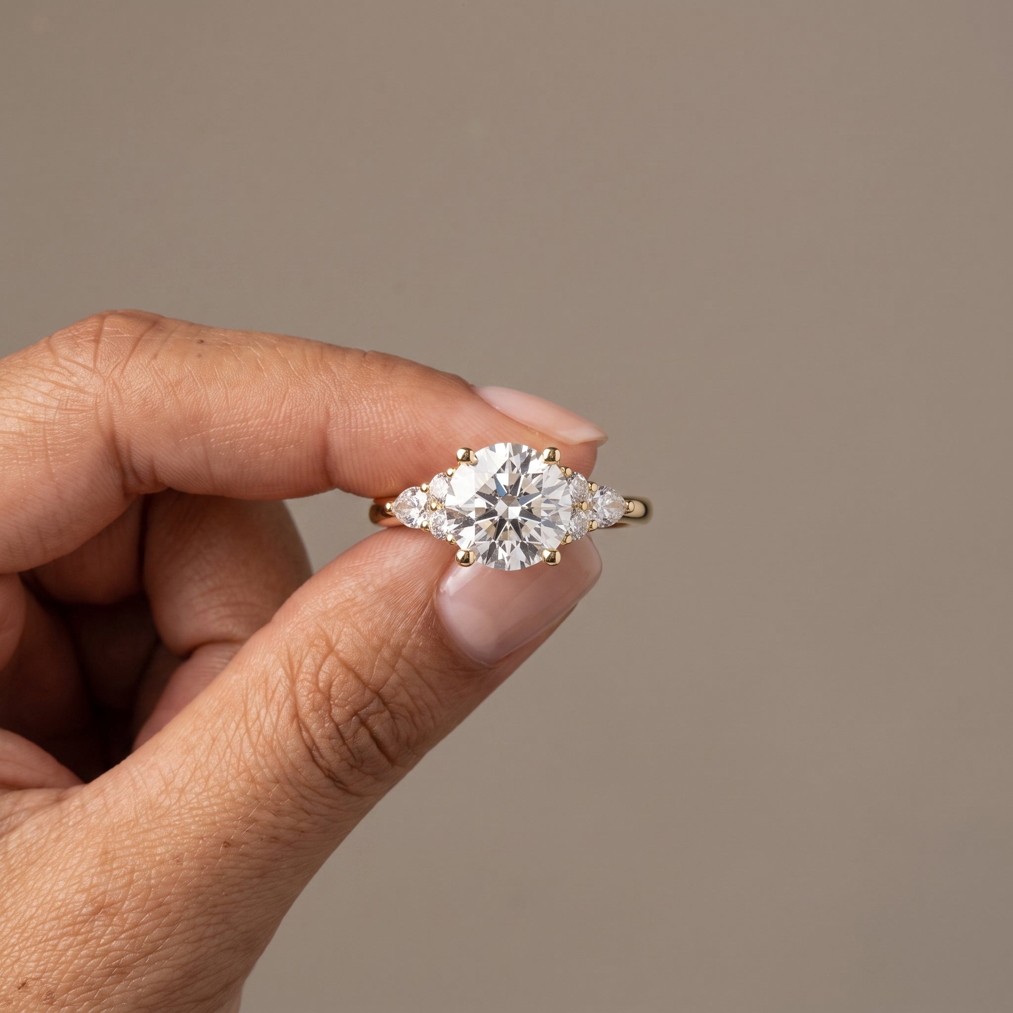 Yellow Gold Round Moissanite Engagement Ring with Side Stones