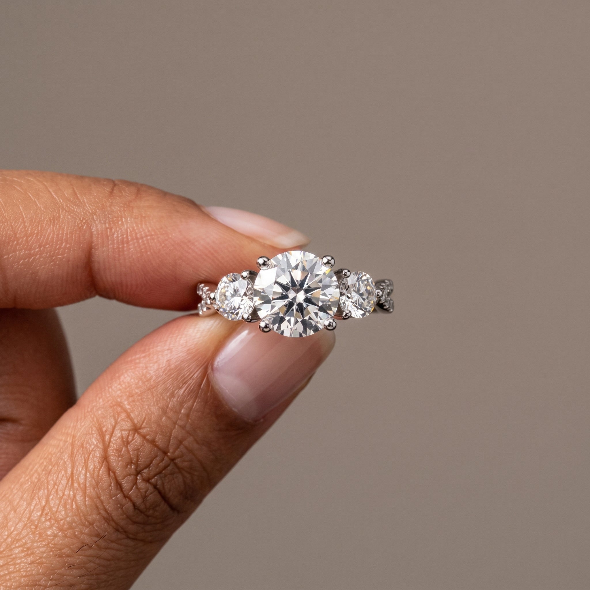 White Metal Round Moissanite Three-Stone Engagement Ring