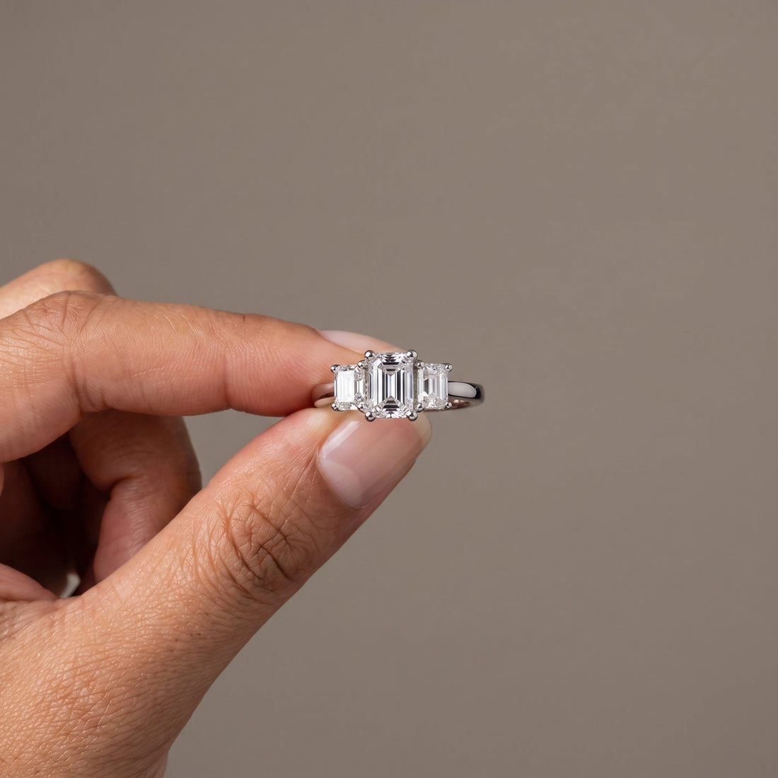 White Emerald Cut Three-Stone Engagement Ring