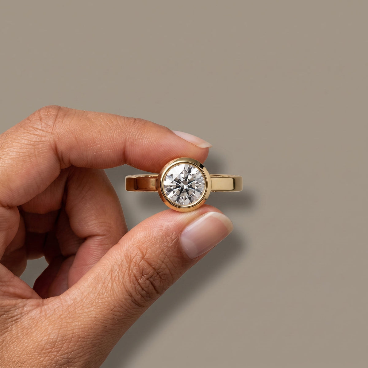 Yellow Gold Round Moissanite Bezel Engagement Ring
