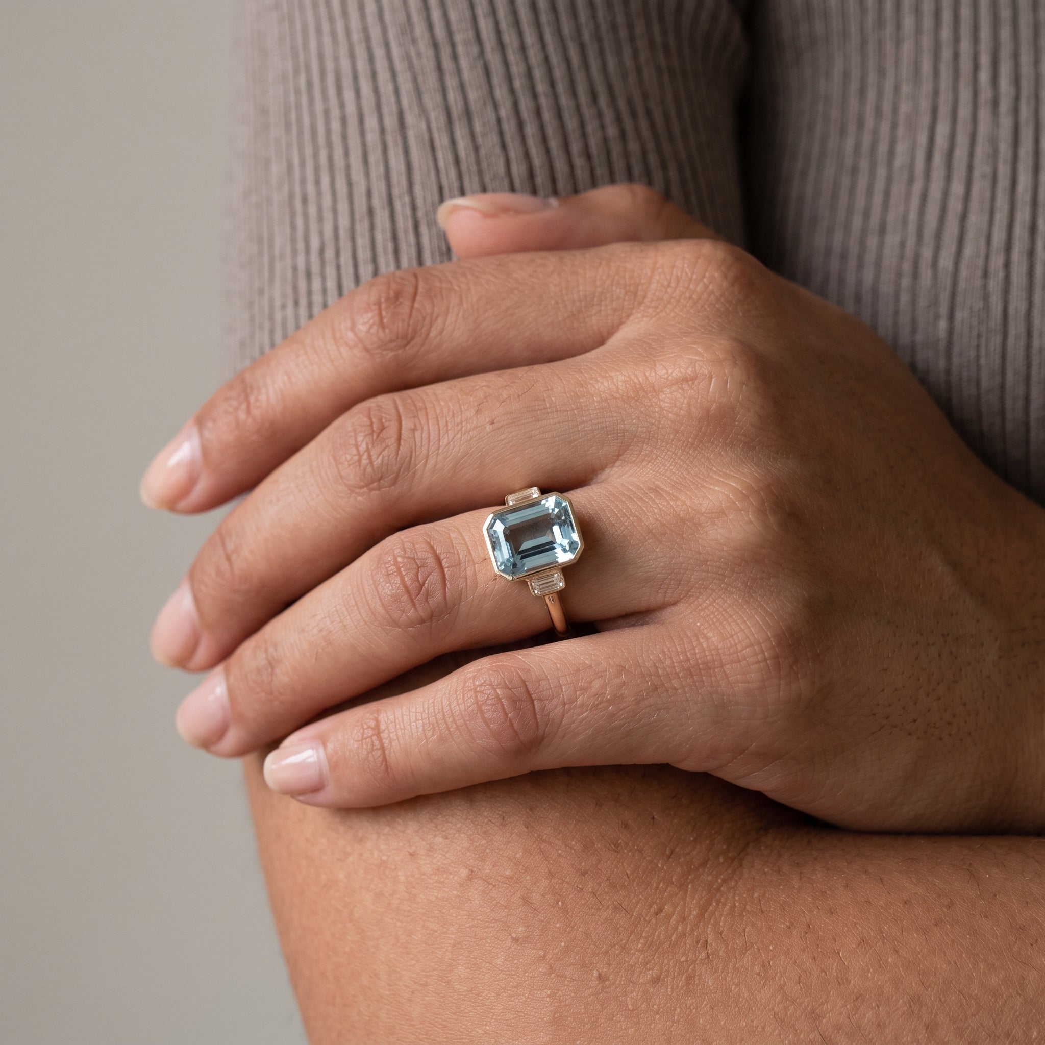 Yellow Gold Emerald Cut Blue Moissanite Three-Stone Ring