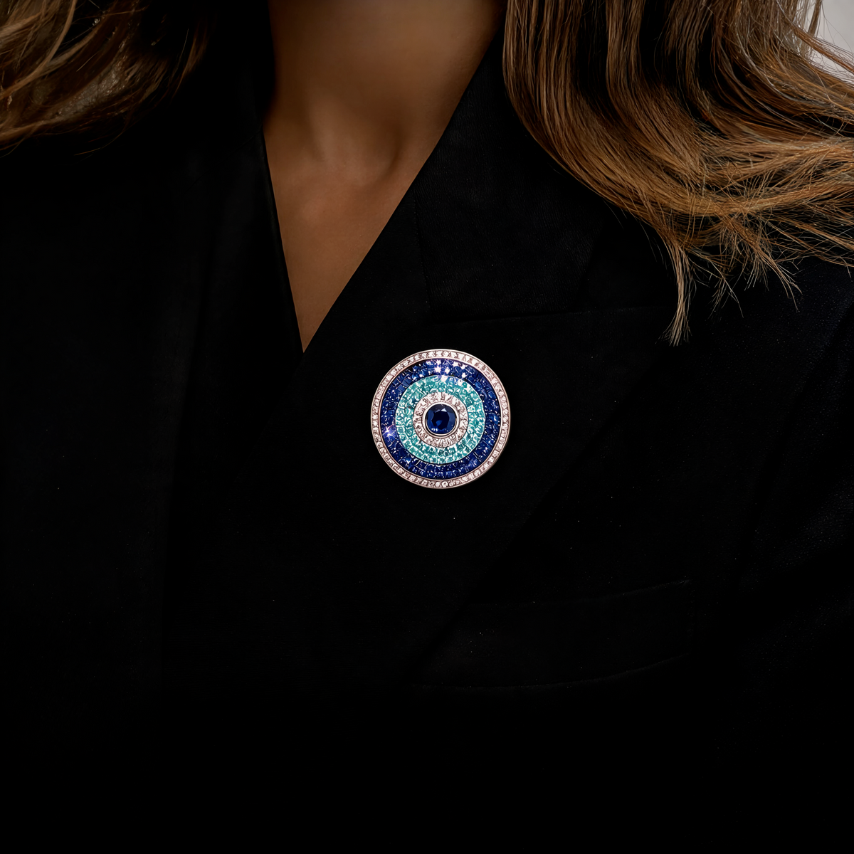 Blue evil eye diamond bag charm styled on black clothing